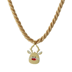 Close-up of golden reindeer pendant on woven cord necklace for Christmas holiday