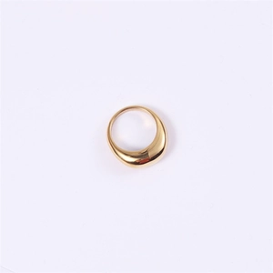 Detail view of a thick dome ring with high-polished gold finish and rounded geometric arc