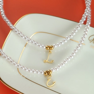 Elegant pearl necklace with 18K gold plated letter pendant and heart detail