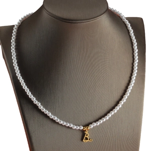 18K gold plated necklace with white pearls and letter B heart pendant on a bust