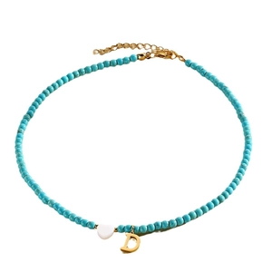 Green turquoise beaded choker necklace with a white heart shell and golden D pendant
