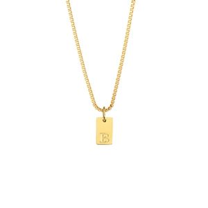 Macro detail of gold-plated box chain with square pendant engraved with letter B