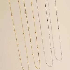 Close-up of gold and silver stainless steel beaded snake chains for women necklaces