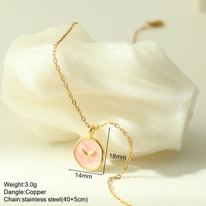 Detail of pink enamel round pendant with golden wings on stainless steel chain