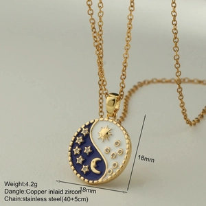 Macro detail of enamel sun moon star pendant on a slim stainless steel chain
