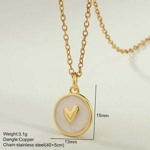 Macro shot of gold enamel heart pendant with stainless steel chain and product dimensions
