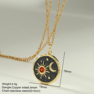 Detail of sun and moon pendant with red zircon inlay on stainless steel chain