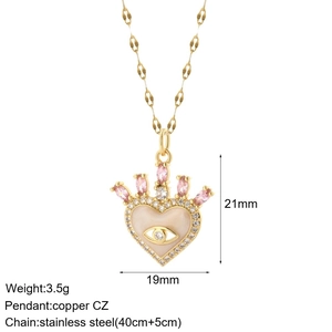 Detailed view of heart pendant with pink stones, evil eye motif and 40cm+5cm paperclip chain