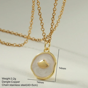 Detail of enamel shell pendant on a gold stainless steel chain necklace for women