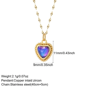 Detail of red heart pendant with blue-purple gradient stone and paperclip chain