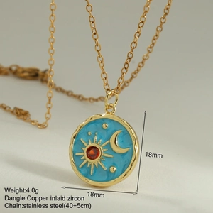 Macro detail of enamel sun and moon pendant with dimensions and stainless steel chain specs