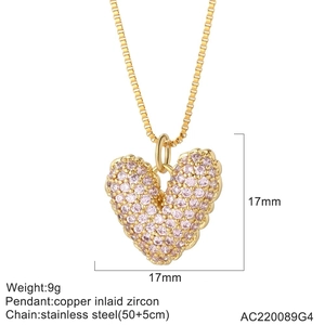 Macro view of heart pendant with pink zircon inlay and dimensions 17mm by 17mm