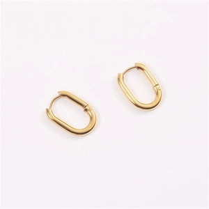 Detailed view of polished oval gold-plated stainless steel earrings with a hinged closure