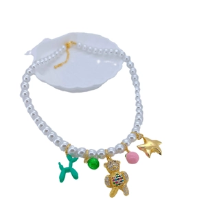 Charming pearl beaded necklace with green balloon dog and colorful teddy bear charms