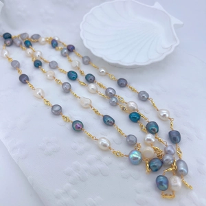 Elegant multi-color baroque pearl necklace with gold zircon links on shell tray