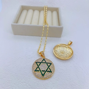 Gold Star of David pendant necklace with green stones and iced-out pave crystals