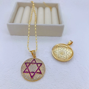Detail of gold Star of David pendant with purple and white cubic zirconia stones