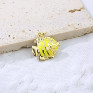 Detailed view of yellow enamel fish pendant in gold-plated brass for necklaces