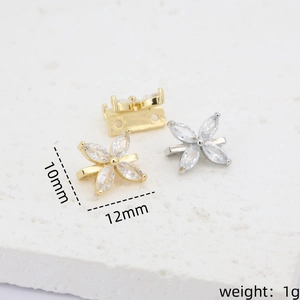 Macro view of 14k gold plated flower spacer with cubic zirconia, size 10mm x 12mm