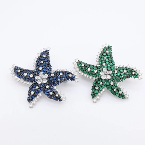 Detail of starfish brooches with micro-paved blue and green cubic zirconia stones