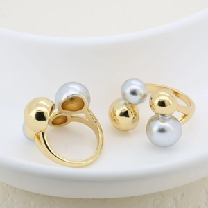 Detailed view of two-tone adjustable open ring featuring gold and silver spherical beads