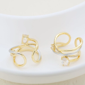 Detail of two-tone layered ring featuring sparkling oval and round cubic zirconia stones