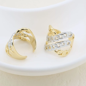 Detailed view of adjustable two-tone gold and silver chain link multilayered ring
