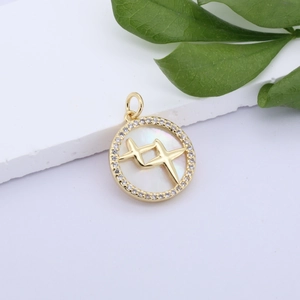 Close-up of gold-plated butterfly shell pendant with zircons on stone and leaf base