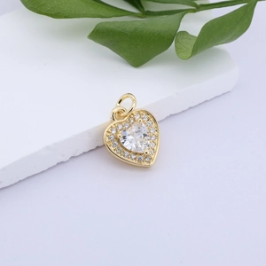 Macro shot of gold-plated heart pendant with sparkling pavé cubic zirconia inlay