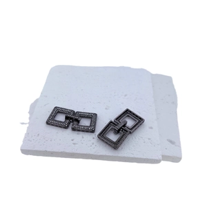 Square micro-paved cubic zirconia jewelry clasp in gunmetal finish on white stone