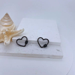 Macro shot of heart-shaped screw clasp in gun black finish with micro-pave zircons
