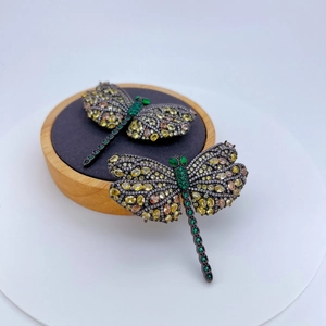 Luxurious dragonfly brooch set with vibrant multicolored zircon on black metal base