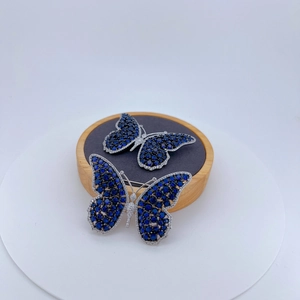 Luxurious silver butterfly brooch with deep blue zircon and sparkling white crystals
