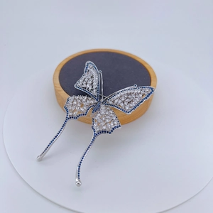 Exquisite silver-plated butterfly brooch with white zircon and blue crystal accents