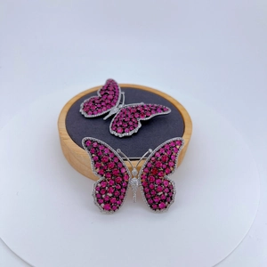 Exquisite luxury butterfly brooch with deep pink crystals and white diamonds in silver tone