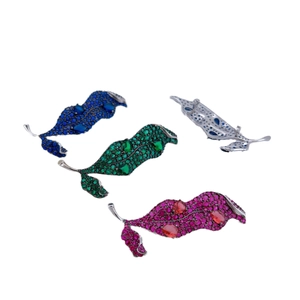 Leaf-shaped zircon brooches in blue green and rose red colors with alloy pin backing