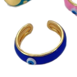 Adjustable evil eye ring with gold plating and blue enamel detailing on white background