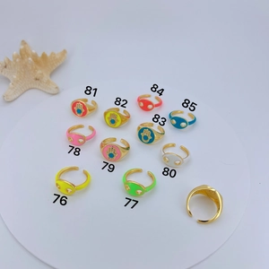 Collection of colorful enamel Hamsa hand and geometric open rings with zircon detail