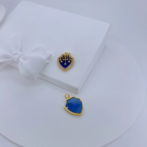 Retro 18K gold plated shield pendants with blue enamel, star patterns, and zircon inlay