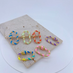 Macro shot of colorful enamel copper carabiner clasps with micro-pave cubic zirconia stones