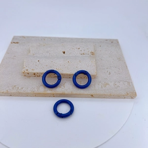 Three blue circular spring O-rings in vibrant lacquer finish for DIY jewelry and keychains