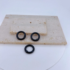 Three glossy black round spring O-rings for DIY jewelry and keychain accessories
