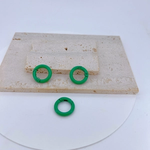 Three green enamel-coated copper spring O-rings for DIY jewelry and keychains