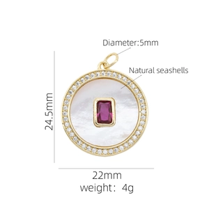 Detail of 18K gold heart pendant with natural seashell and red gemstone inlay