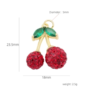 Detailed view of red rhinestone cherry pendant with gold plating and dimensions