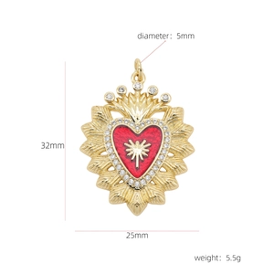 Macro shot of 18k gold plated copper heart pendant with red enamel and white zircons