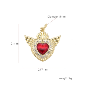 Detail of 18k gold plated copper heart pendant with red stone and wings measuring 21.7mm