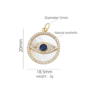 Macro detail of 20mm Evil Eye pendant with natural shell and micro-pave white cubic zirconia