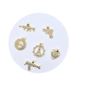Hip hop gold plated pistol and heart pendants set with sparkling zircon stones