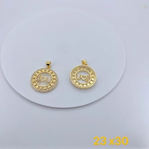 Detailed view of two gold circular pendants with I Love You cutout and zircons